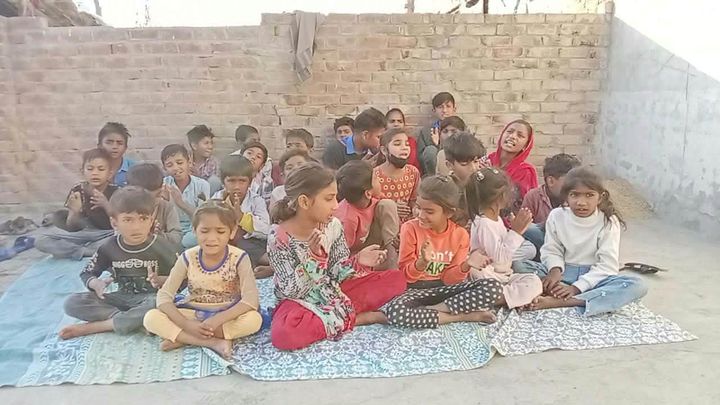 Photograph 1 of 13 sent from the ministry in Pakistan: children and families gathered outdoors
