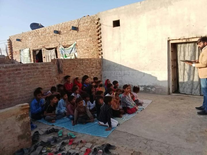 Photograph 4 of 13 sent from the ministry in Pakistan: children and families gathered outdoors