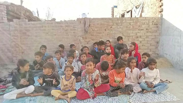 Photograph 6 of 13 sent from the ministry in Pakistan: children and families gathered outdoors