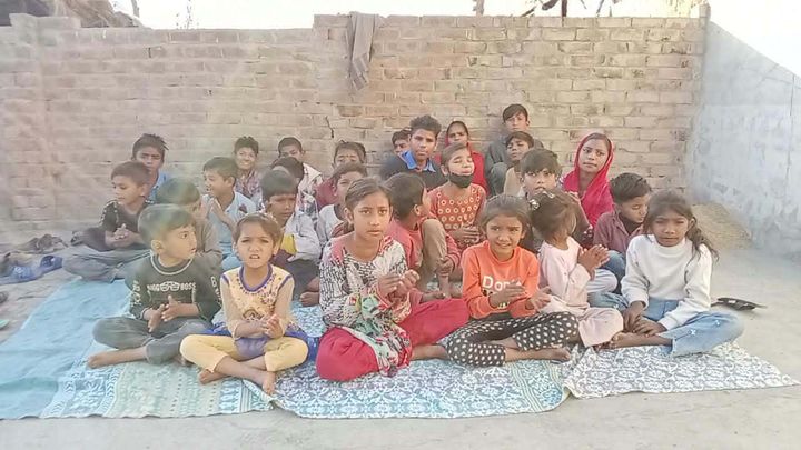 Photograph 10 of 13 sent from the ministry in Pakistan: children and families gathered outdoors